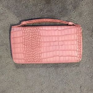 Pink snakeskin clutch